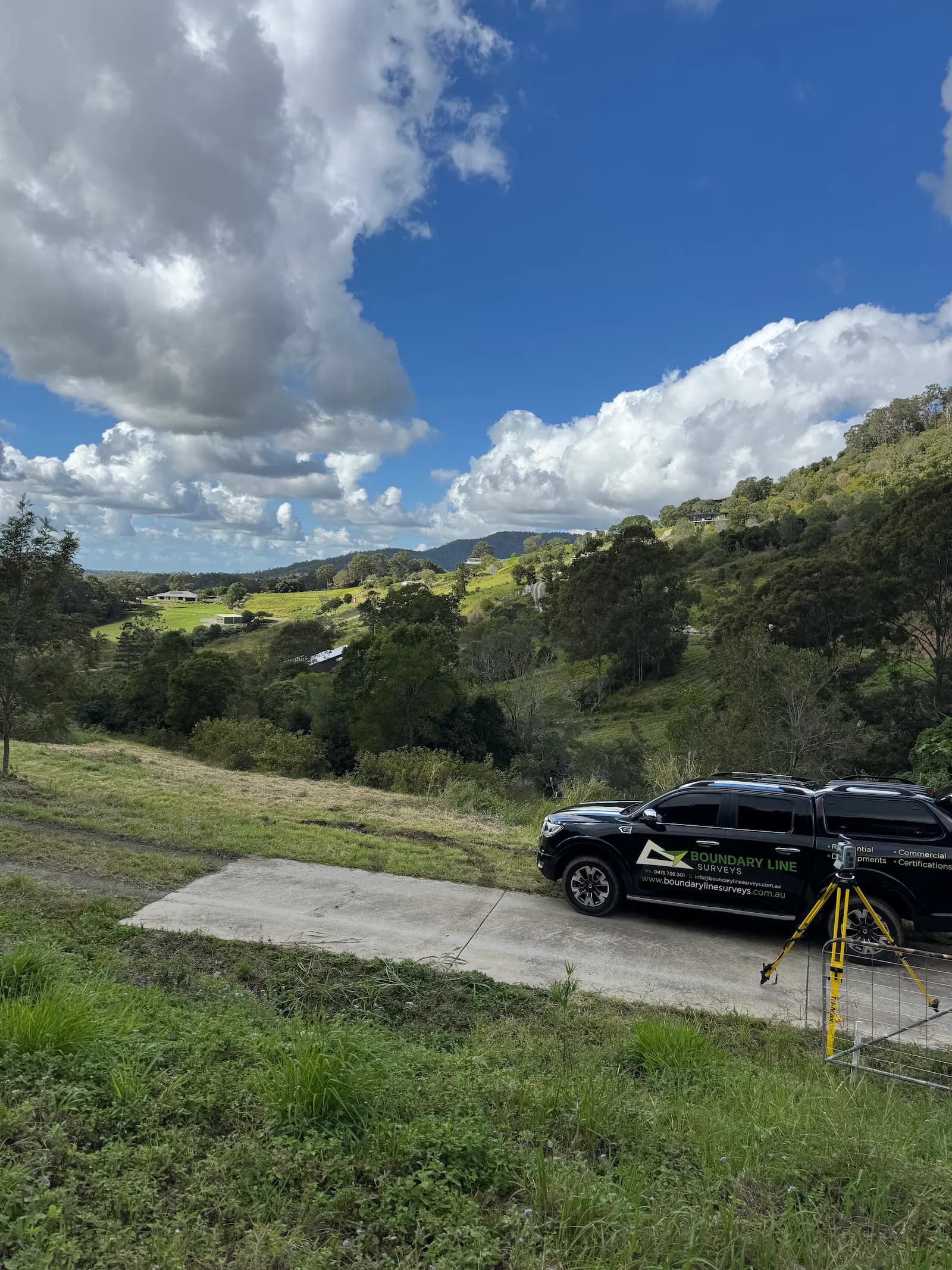 Boundary Line Surveys ute and survey equipment in the field